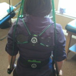 girl wearing gravity fitness exercise equipment at Australian Physiotherapy Specialists